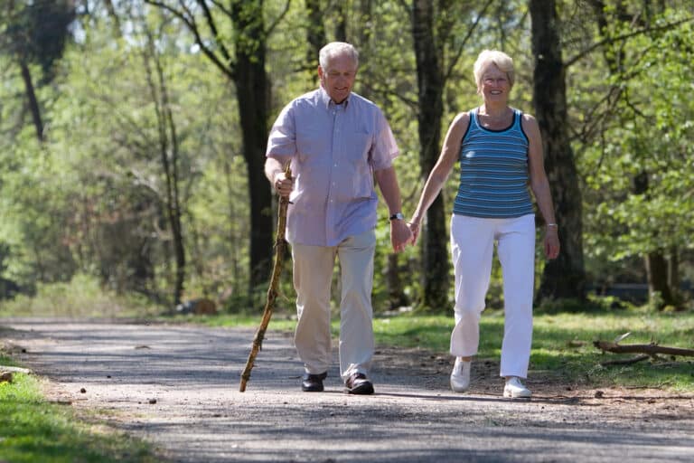 Senior couple walking in the park