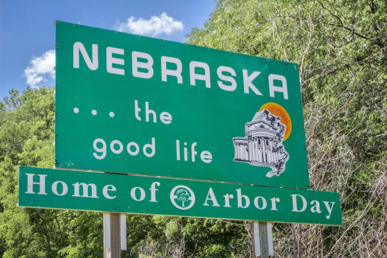 Nebraska road sign reading Nebraska The Good Life and Home of Arbor Day
